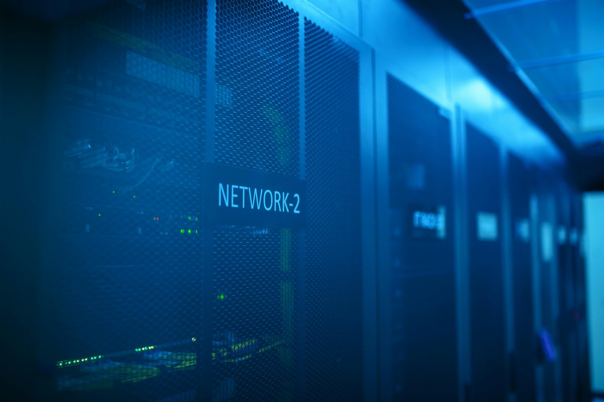 Blue-lit server racks in a data center representing tested recovery systems